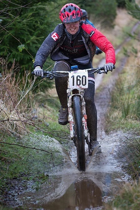Team Tredz rider Alex tackles a puddle